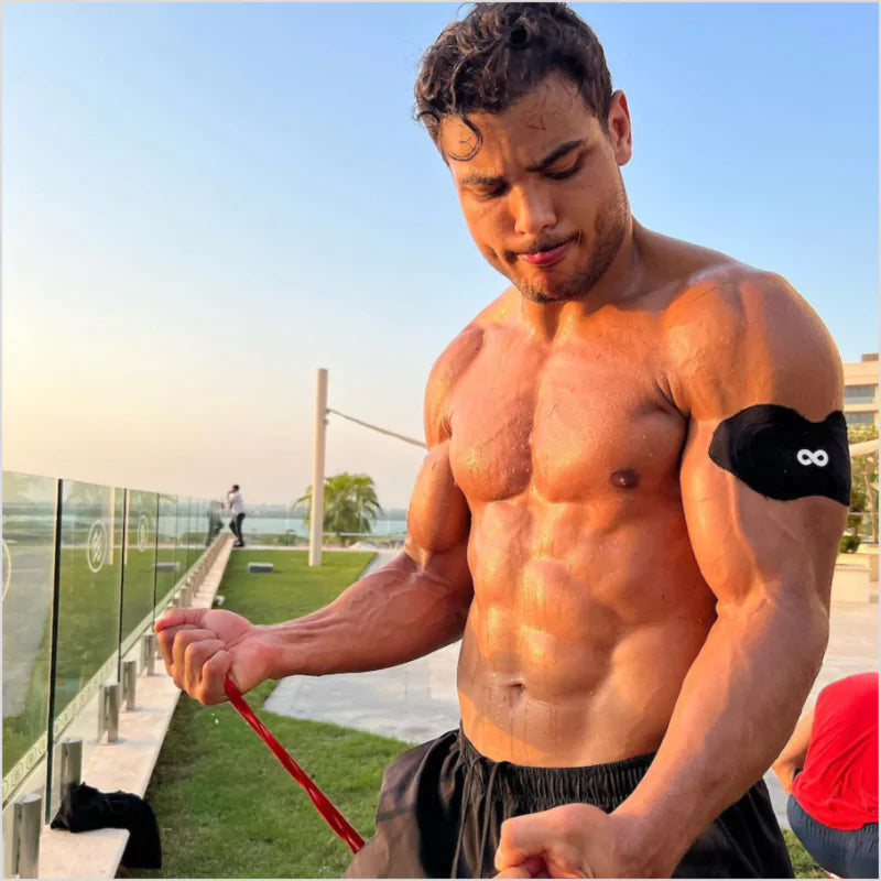 A man wearing an Ion Layer NAD+ iontophoresis patch on his arm after training