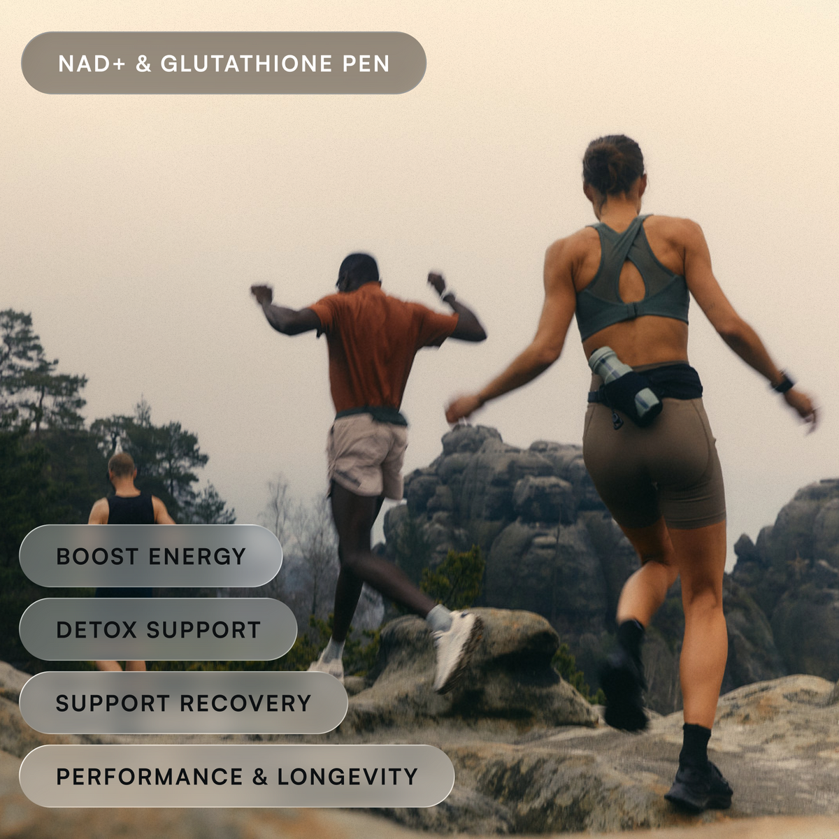 Two people running across rocky outcrops on a misty morning, with energy, detox, recovery and longevity benefit labels.
